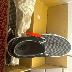 Men’s slip on vans.  Grey and black checkered